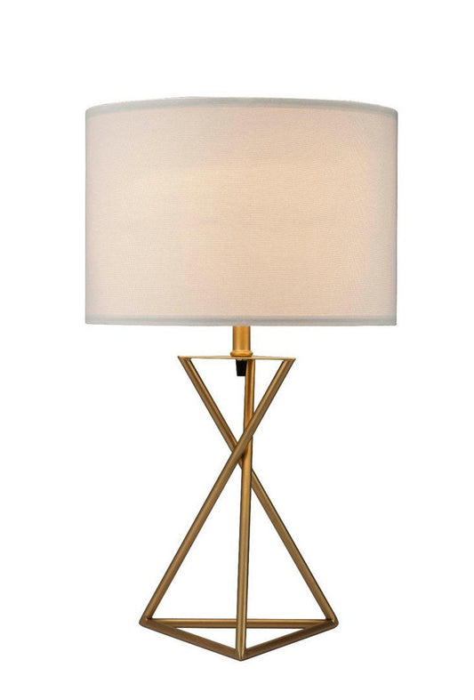 Matte gold Ester mid-century hourglass table lamp on a side table in a modern living room