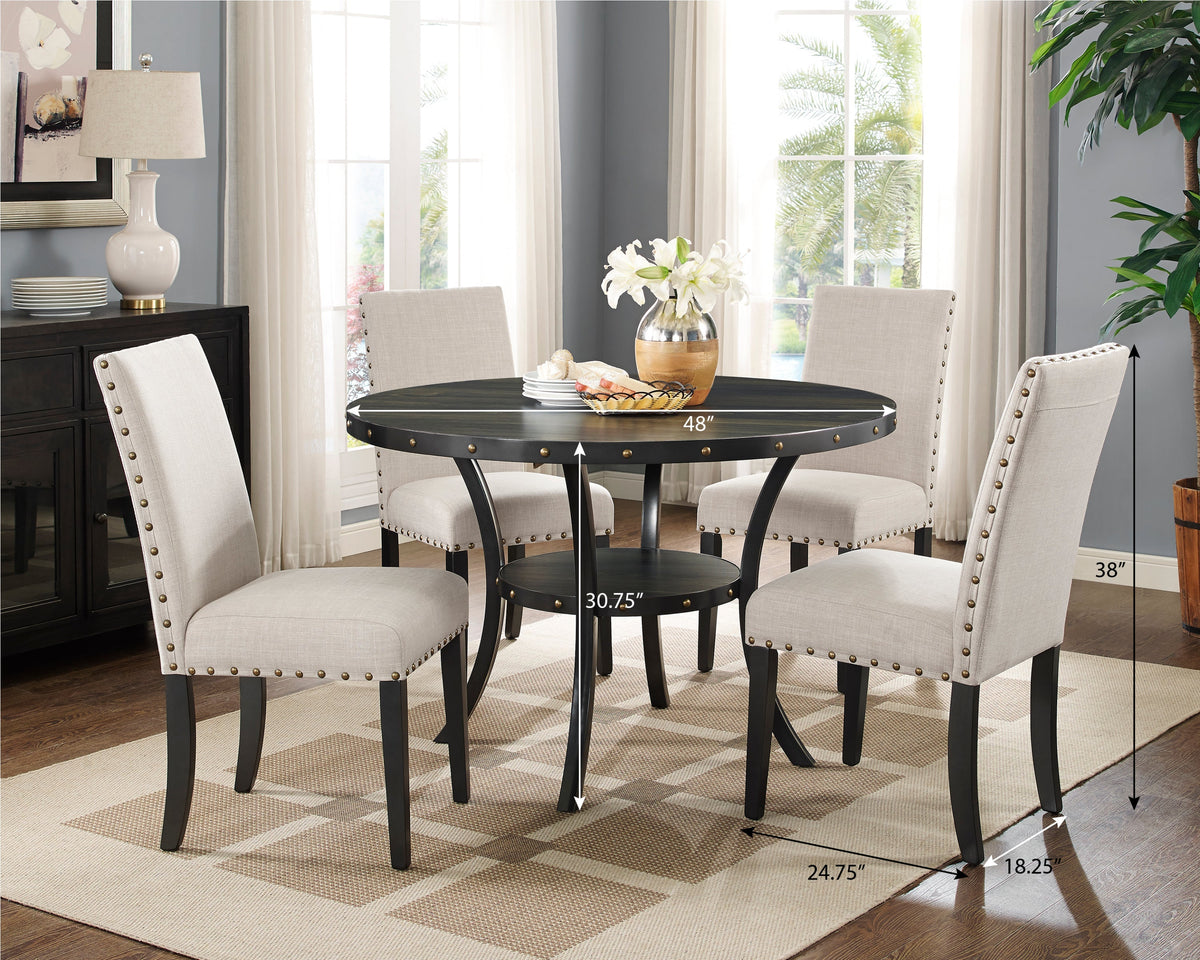 Espresso round dining table with four tan upholstered nailhead chairs in a dining room