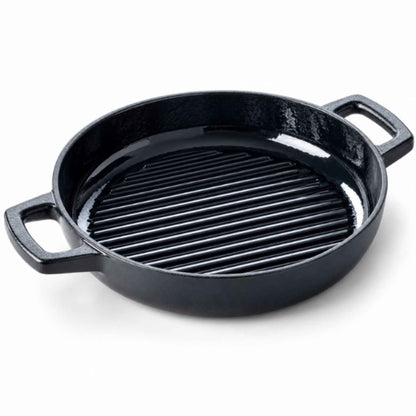 11-inch enameled cast iron grill pan with raised ridges searing steak on a kitchen stovetop