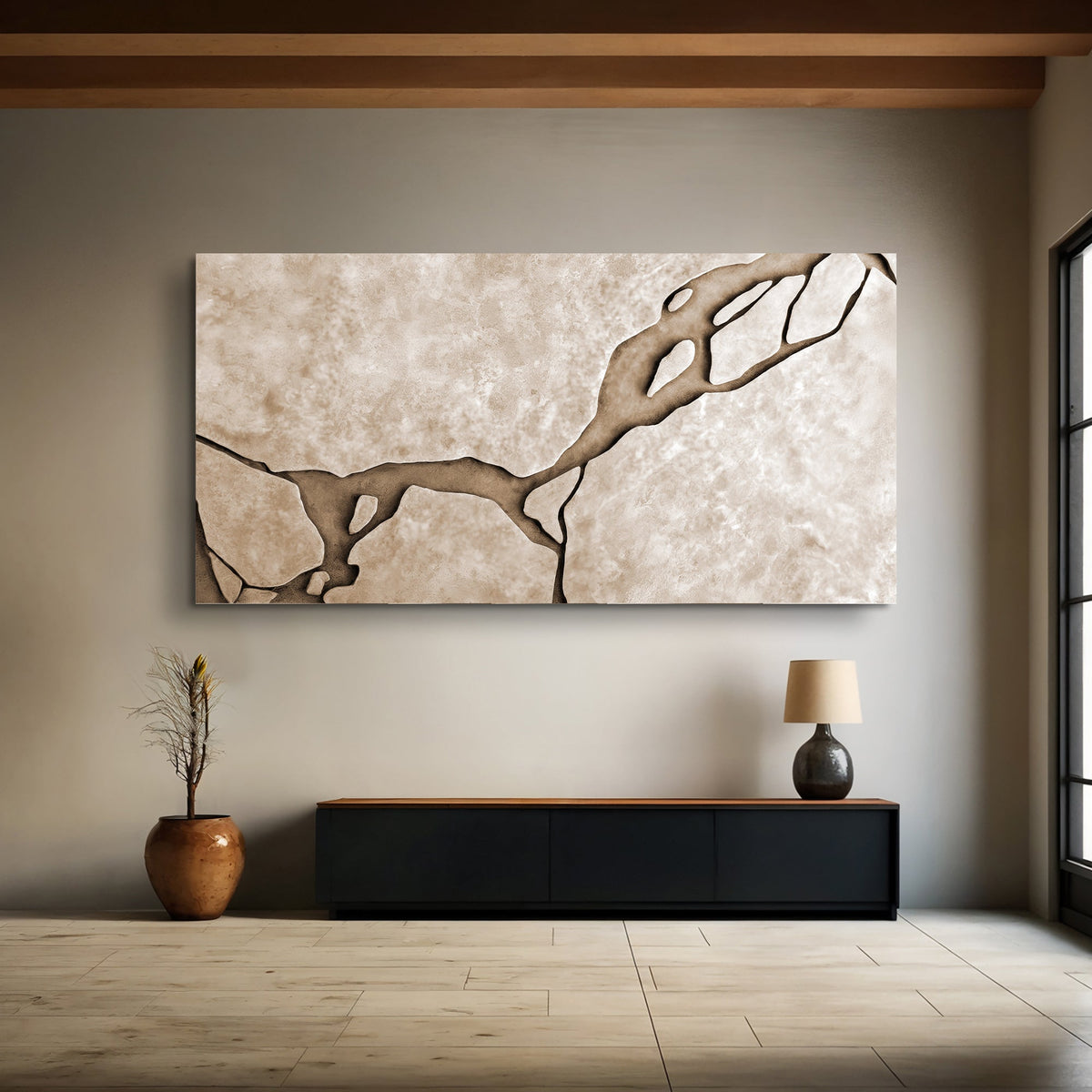 Wide muddy earth tone abstract canvas wall art above a bench in an organic-modern entry