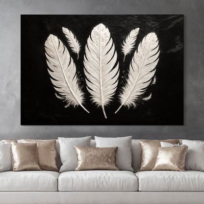 Minimalist monochrome feather canvas wall art in a light Scandinavian hallway