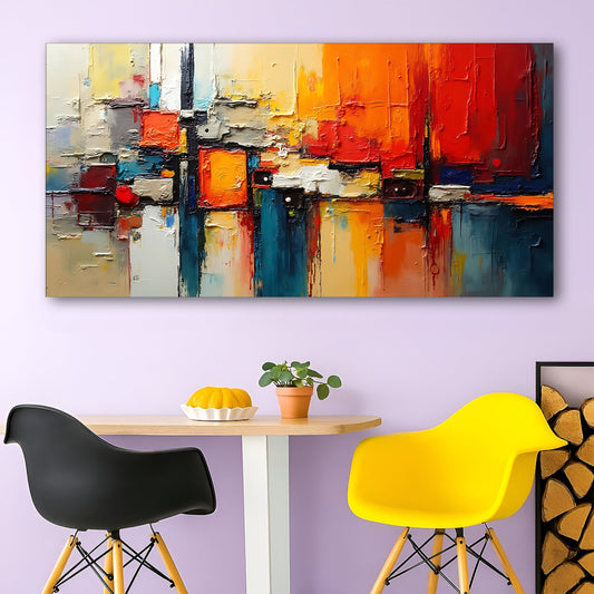 Wide colorful abstract canvas wall art II above a low bookcase in a creative studio