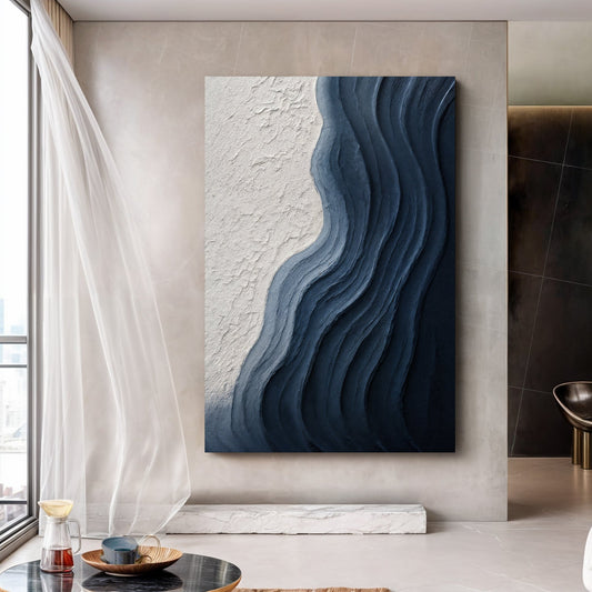 Abstract minimalist wave impasto canvas wall art above a neutral sofa in a modern living room