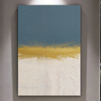Minimalist blue and gold canvas wall art above a gray sofa with brass lamp
