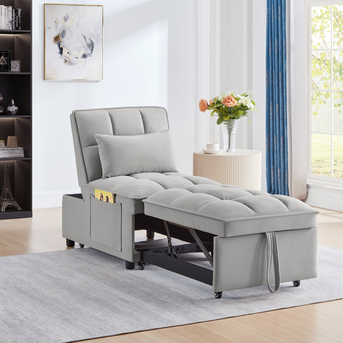 Gray velvet 4-in-1 convertible single sofa bed with storage pockets in a compact studio apartment