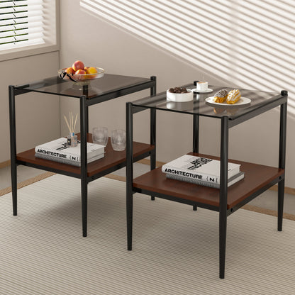 Two gray tempered glass top rectangle end tables with iron frames beside a living room sofa
