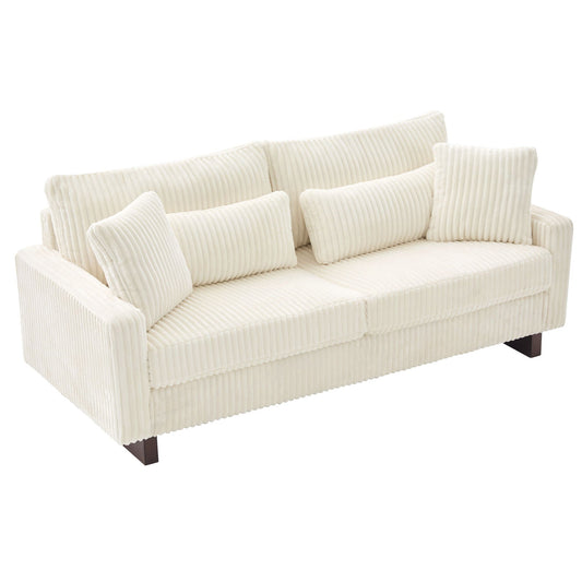 Dark gray modern fabric loveseat sofa with square and lumbar pillows in a contemporary living room