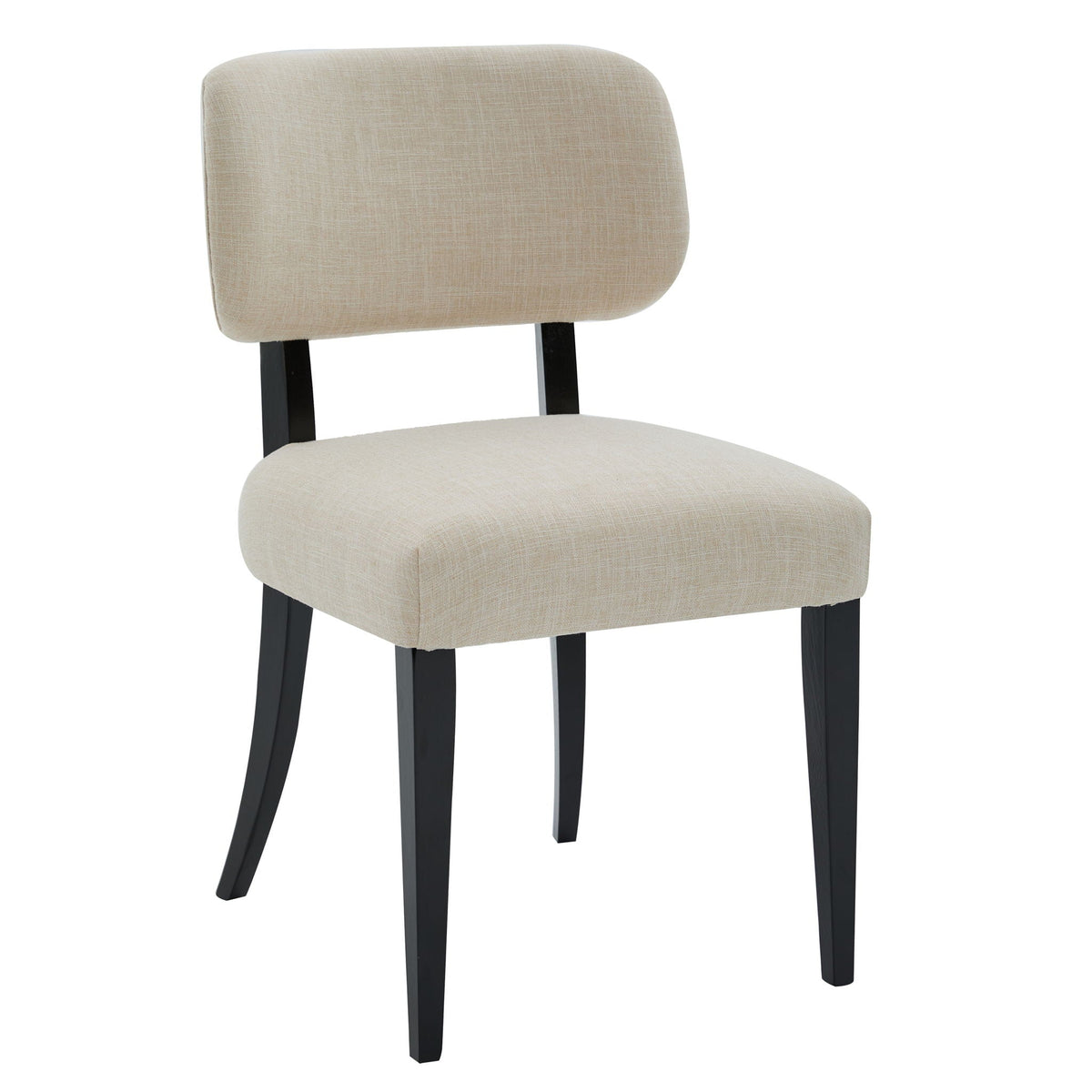 Two cream upholstered farmhouse dining chairs with rubber wood legs at a kitchen table