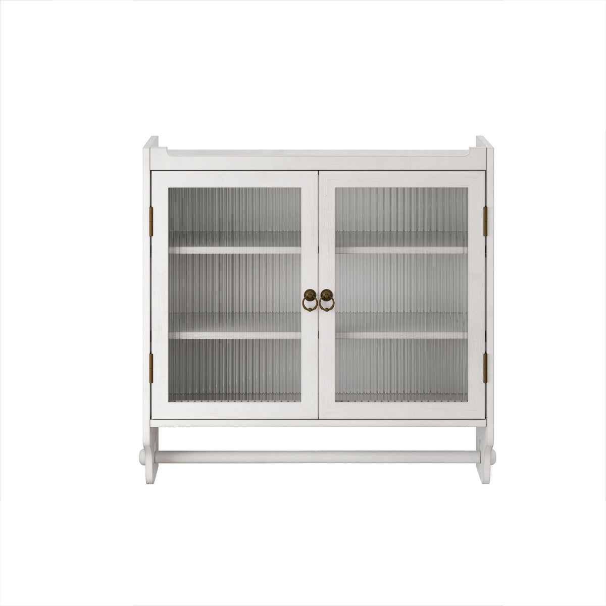 White washed solid wood medicine cabinet with fluted glass doors and towel rack on a bathroom wall