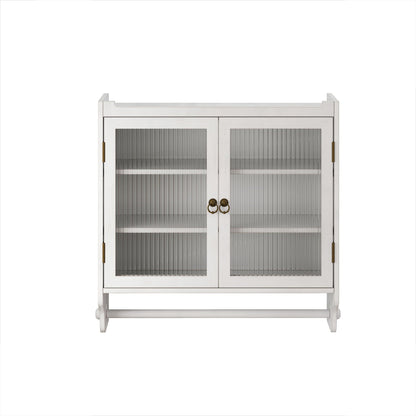 White washed solid wood medicine cabinet with fluted glass doors and towel rack on a bathroom wall