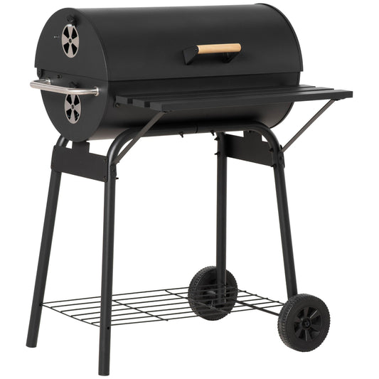 Black steel 30-inch barrel charcoal grill with offset firebox and wooden handles on a patio