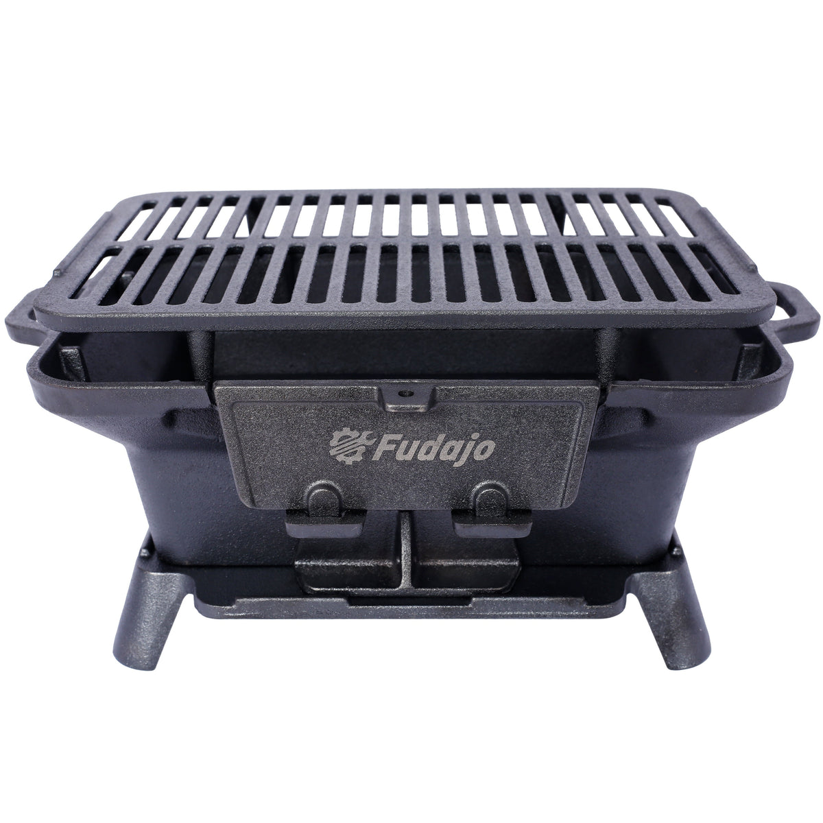 Black enameled oval cast iron tabletop charcoal grill with removable grates on a patio table