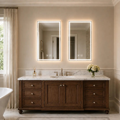 Frameless center glow LED bathroom mirror with soft light bars above a modern bathroom vanity