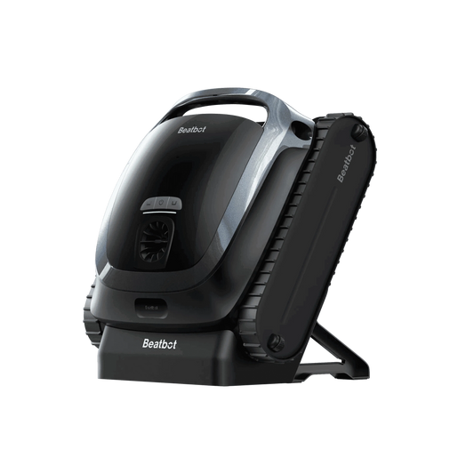 AquaSense 2 cordless robotic pool cleaner scrubbing the waterline of a backyard swimming pool