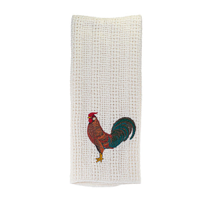 Embroidered 100% cotton kitchen towel with a country rooster design hanging in a farmhouse kitchen