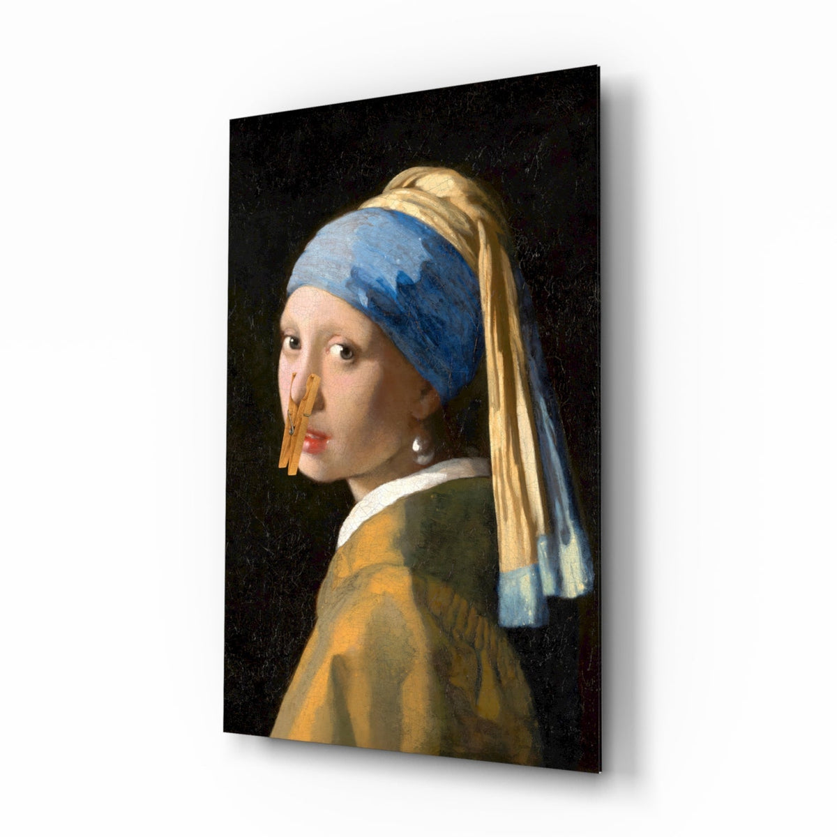 Girl with a pearl earring with clothespin on her nose glass wall art in a powder room