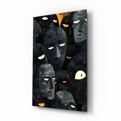 Crowd of stylized charcoal faces with amber eyes glass wall art in a creative loft