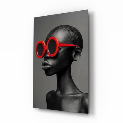 Gray female portrait glass wall art with red round sunglasses hanging on a dressing room wall