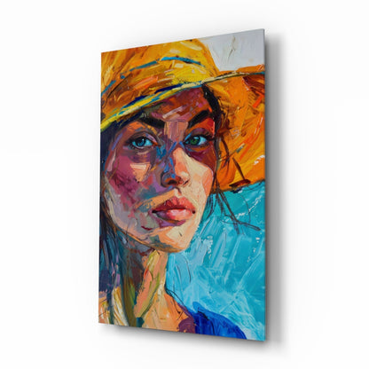 Woman in orange straw hat expressionist portrait glass wall art in a bright coastal living room