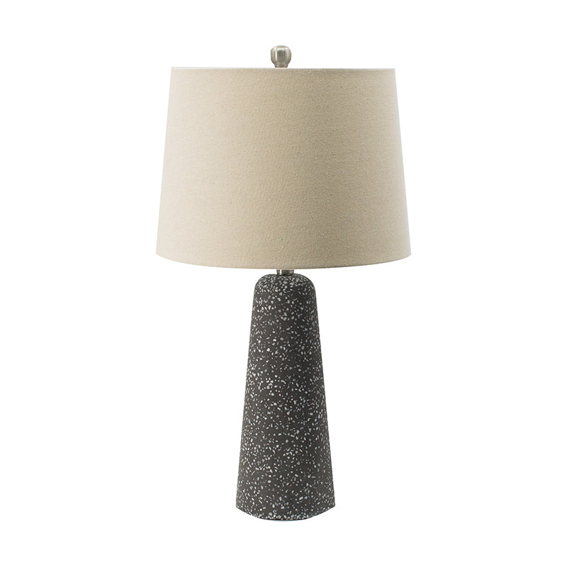 Artisan multicolor glass table lamp with linen drum shade on an entryway console