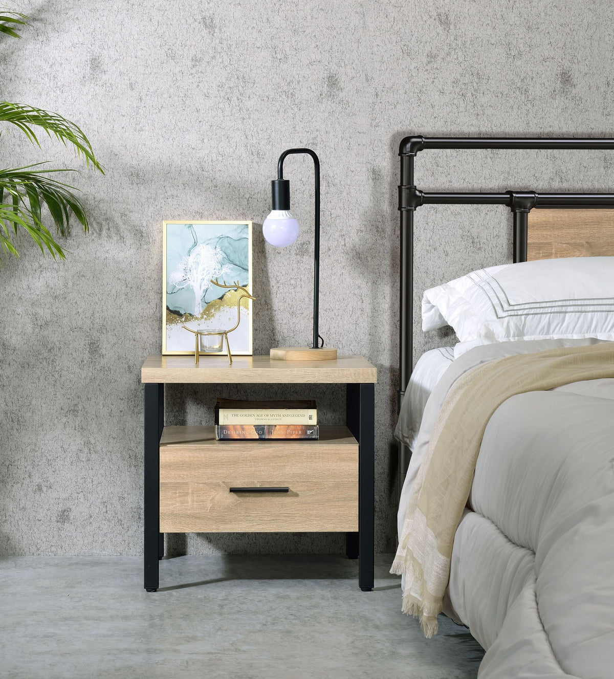 Oak finish nightstand with one drawer, open shelf and black metal legs in a modern bedroom