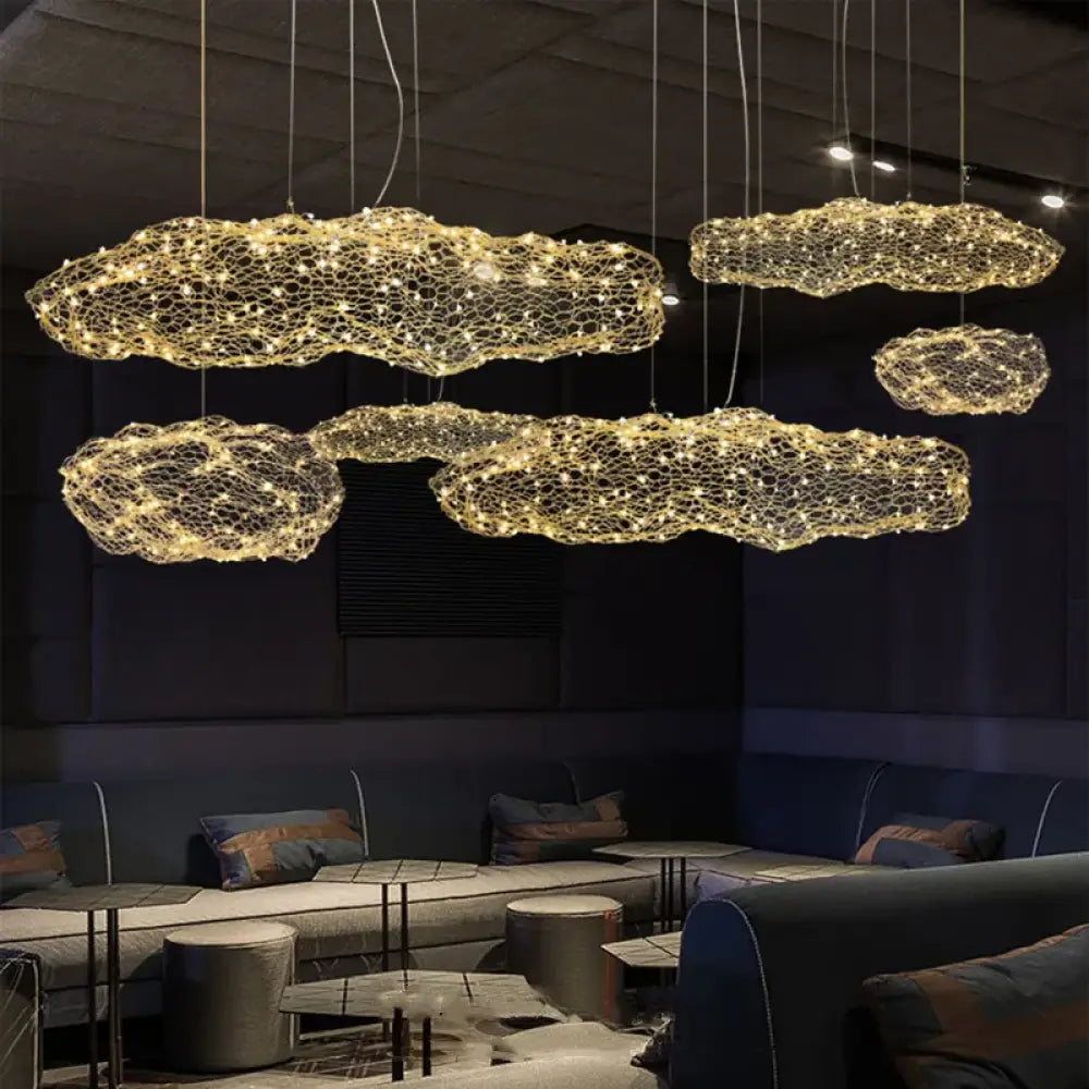 White Art Cloud pendant chandelier with hollow cloud design hanging in a bedroom