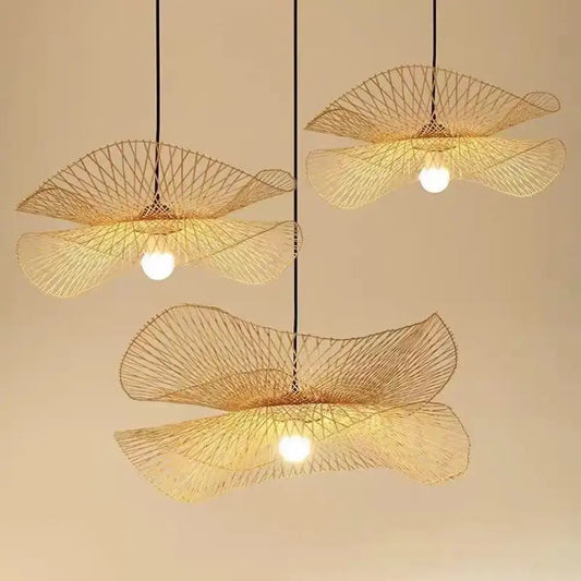 Natural woven bamboo rattan pendant light hanging above a kitchen island in a warm modern kitchen