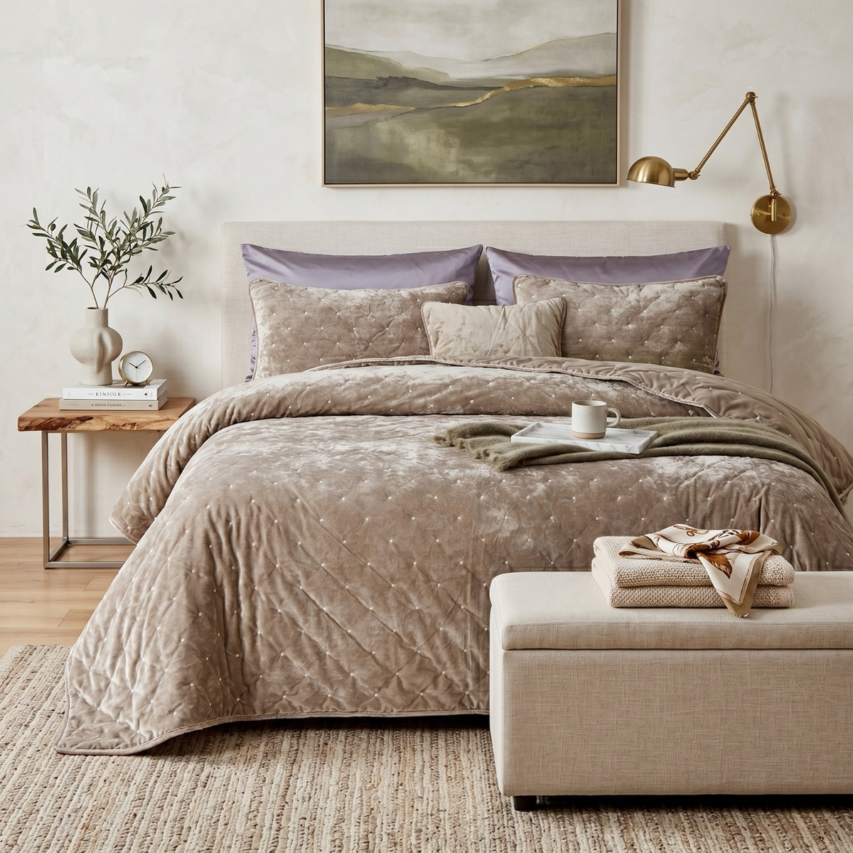 Sand taupe beige tufted velvet quilt set with shams on a bed in a neutral modern bedroom
