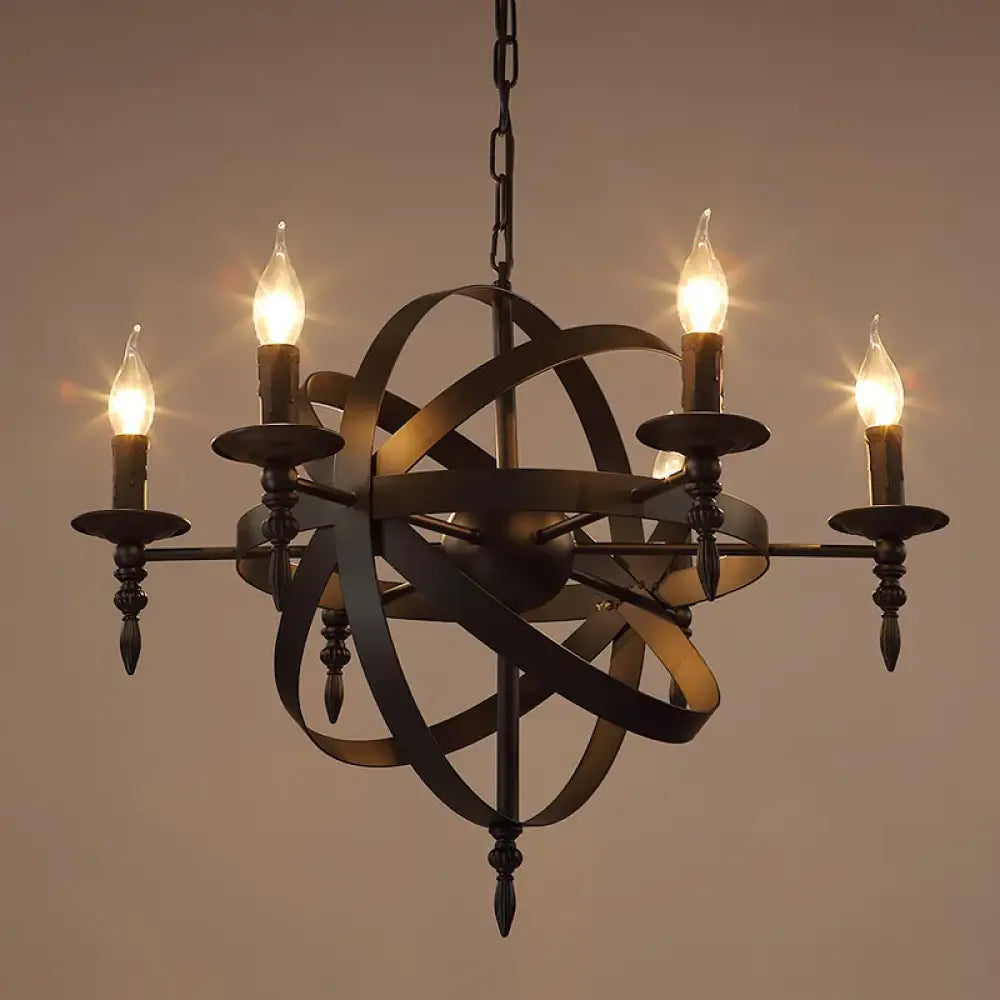 Black wrought iron Camille vintage candle chandelier with eight lights above a rustic dining table