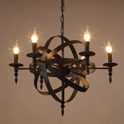 Black wrought iron Camille vintage candle chandelier with eight lights above a rustic dining table