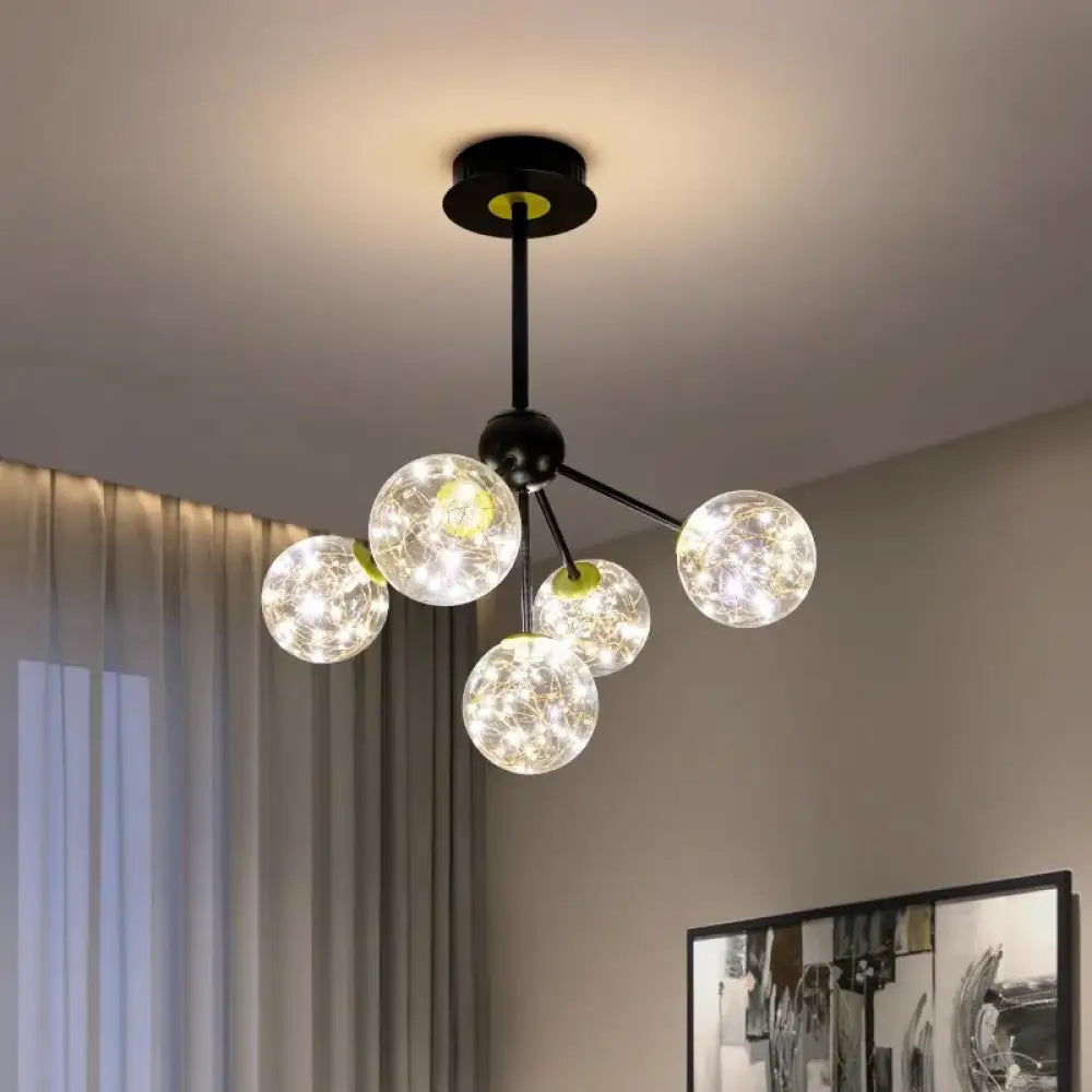 Gold Nordic multi-head ceiling light hanging above a modern dining table
