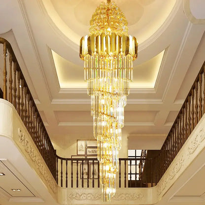Long crystal staircase chandelier cascading through a double-height entryway