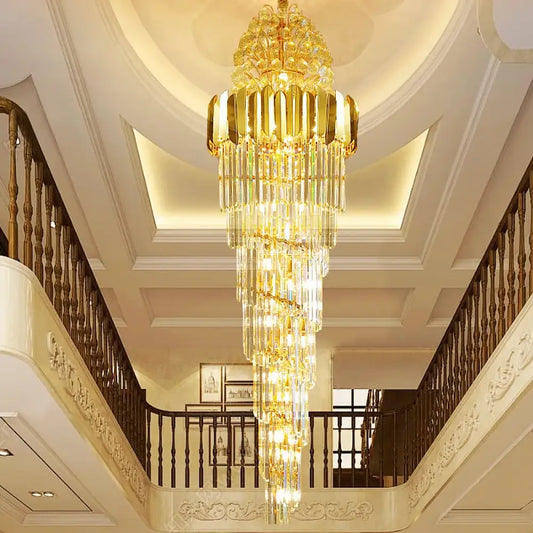 Long crystal staircase chandelier cascading through a double-height entryway