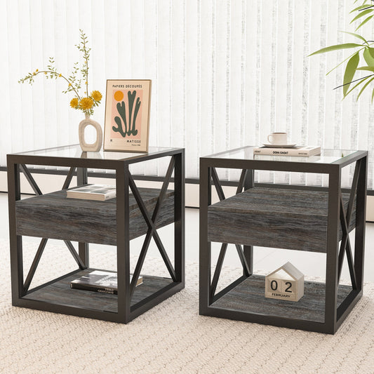 Set of two industrial end tables with glass tops and drawers used as nightstands in a bedroom