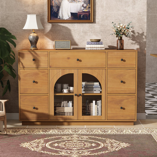 Storage cabinet with seven drawers, glass doors and gold handles at a dining room entrance