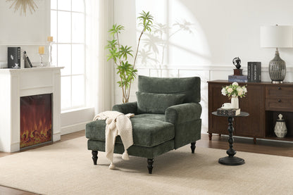 Green upholstered chaise lounge recliner chair with plush cushions in a modern reading corner