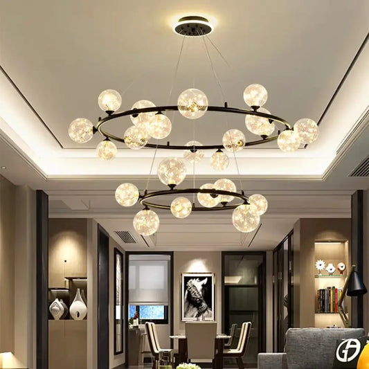 Gold modern LED chandelier with clustered glass globe shades above a dining table
