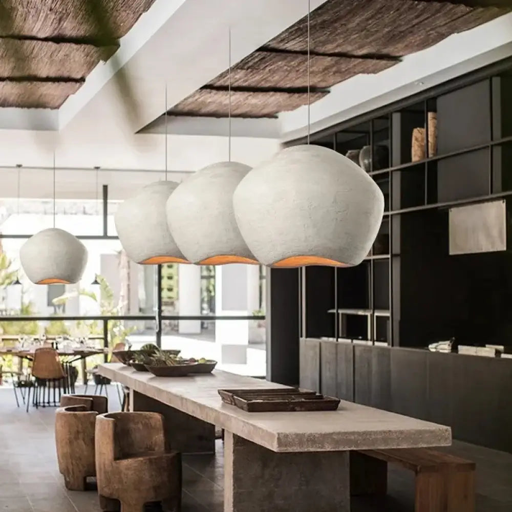 Wabi Sabi Nordic minimalist pendant light with a sculptural shade above a dining table