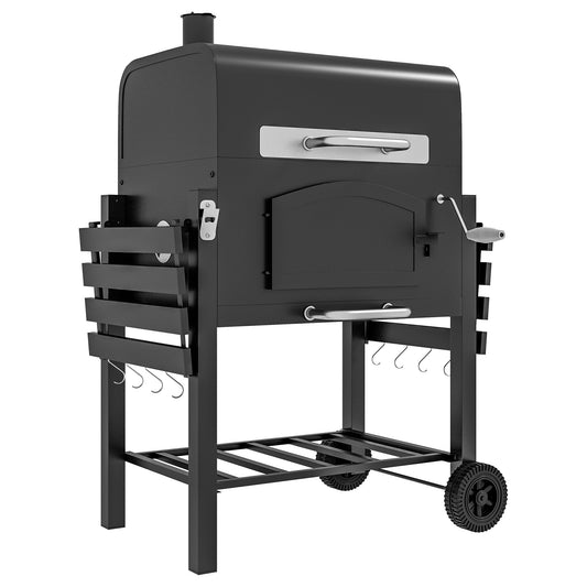 Black steel charcoal grill with folding side shelves, wheels and thermometer on a backyard patio