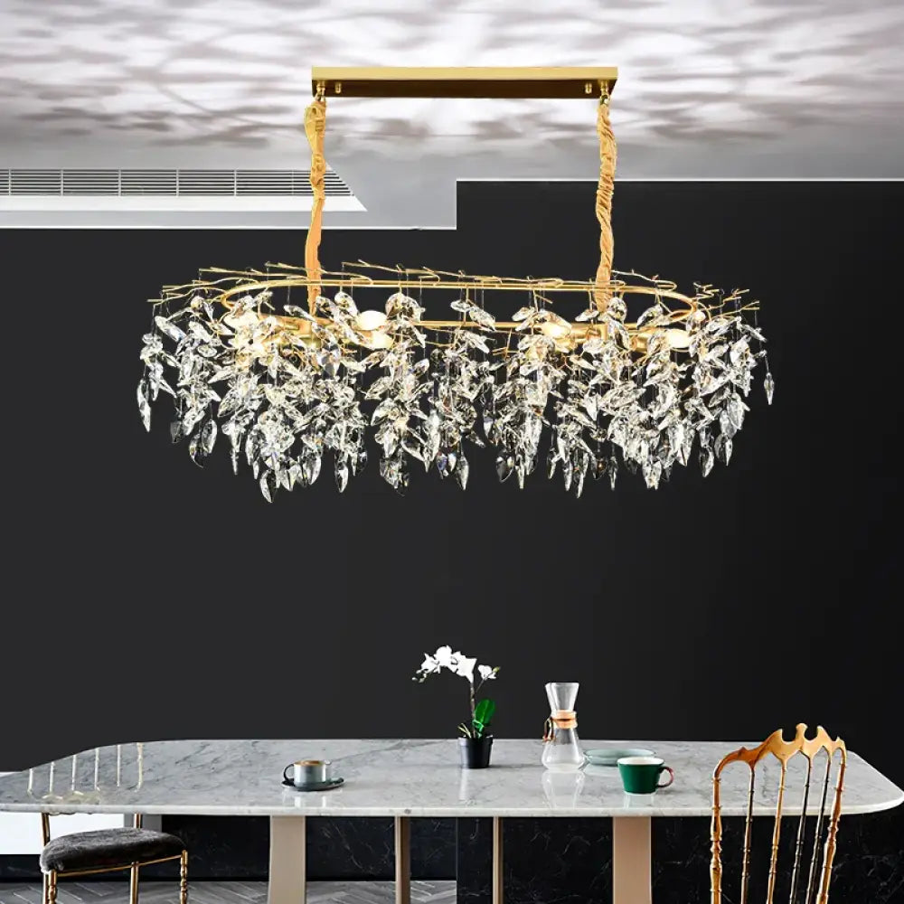 Gold branch-style K9 crystal chandelier above a kitchen island