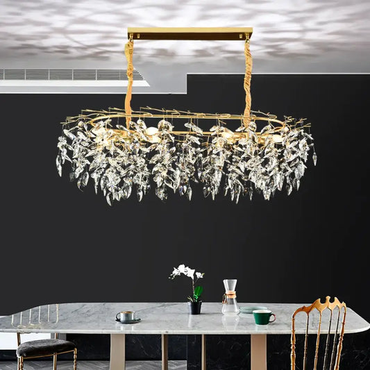 Gold branch-style K9 crystal chandelier above a kitchen island