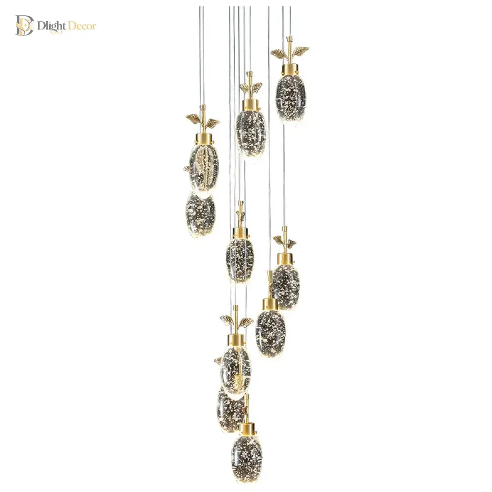 Modern round crystal pendant light with multiple sparkling heads hanging above a dining table
