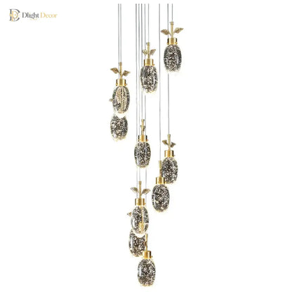 Modern round crystal pendant light with multiple sparkling heads hanging above a dining table
