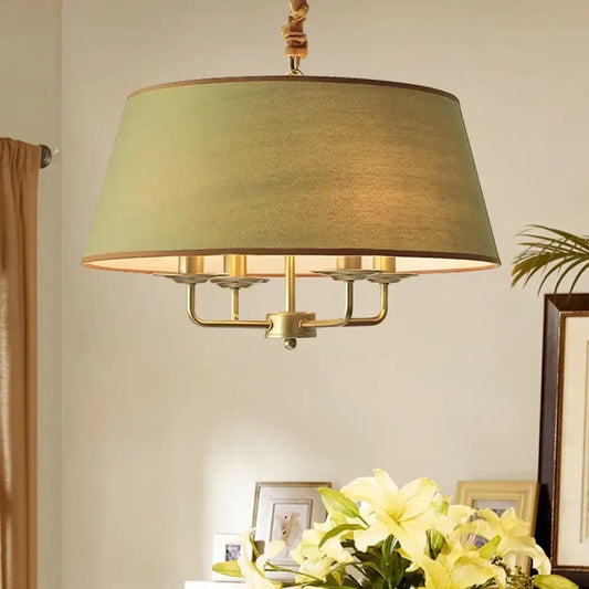 Vintage retro Evelyn pendant light hanging over a dining table in a warm, rustic dining room