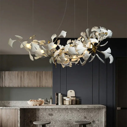 White ceramic ginkgo leaf LED chandelier in a modern living room