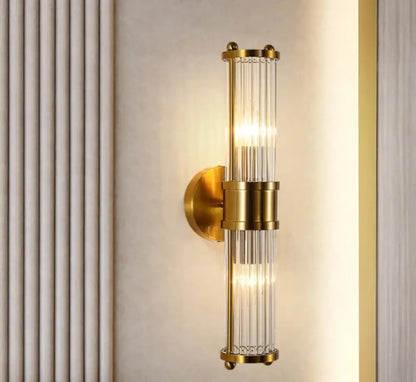 Crystal LED wall sconce with double heads glowing beside a kitchen island