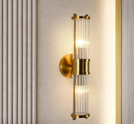 Crystal LED wall sconce with double heads glowing beside a kitchen island