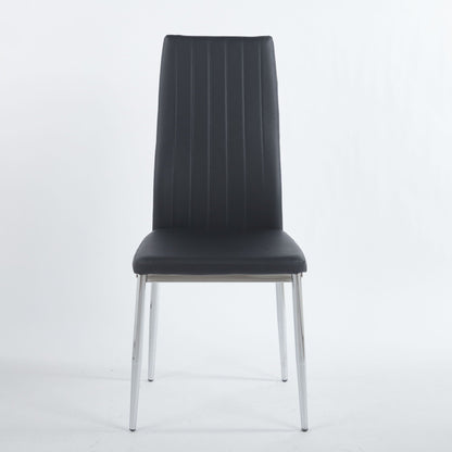 Four minimalist white faux leather dining chairs with metal frames around a modern dining table