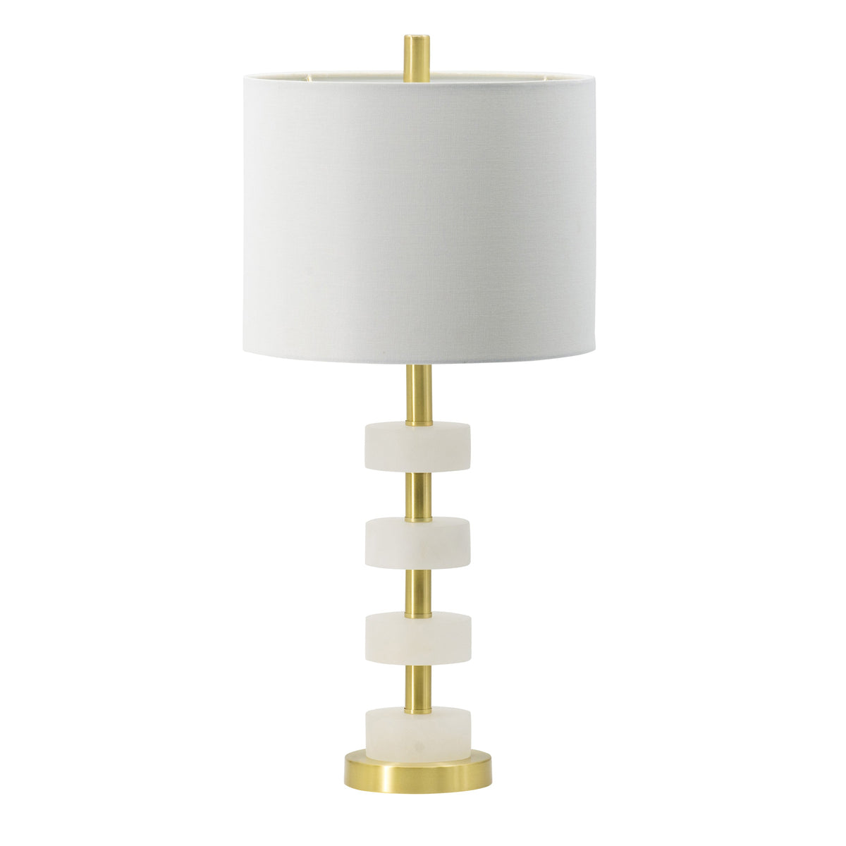 White marble table lamp with gold brass frame and white drum shade on a bedroom nightstand