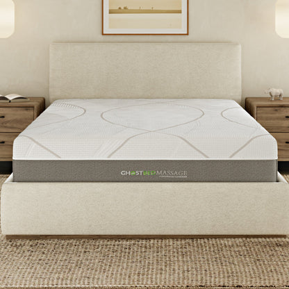 White GhostBed massage hybrid mattress with memory foam on a bed frame in a modern bedroom